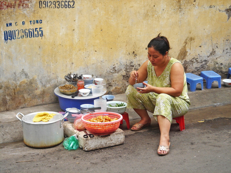 real people, vendor, casual clothing, one person, street, adult, dress, full length, food and drink, indian Culture, vietnamese, green, women, chair, vietnam