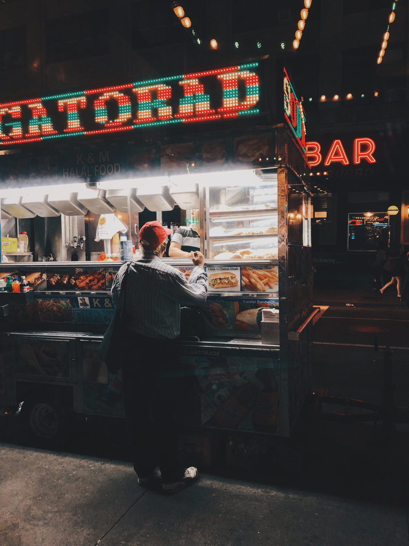 lifestyles, market, food, beside, lights, real people, city, stores, business, architecture, night, one person, commerce, retail, stall, merchant, woman