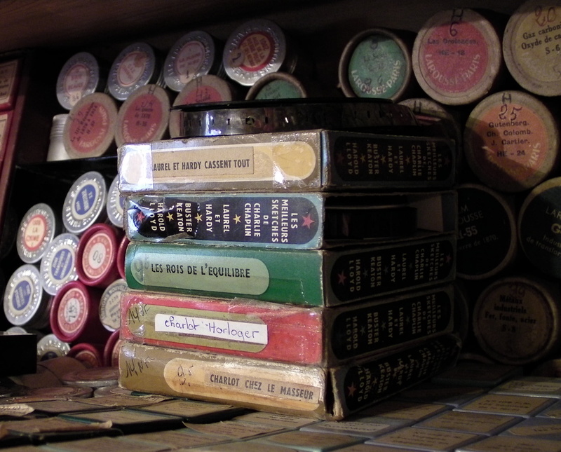 still life, large group of objects, container, indoors, collection, no people, text, variation, film, technology, close-up, transparent, in a row, home movies