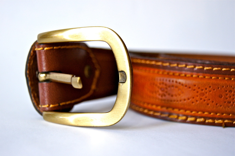 brown, colored background, leather, belt, eyewear, glasses, brass, belts, clothing, sunglasses, fashion, white background, no people, style, buckle, wealth