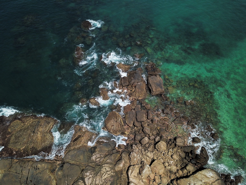 beauty in nature, no people, promontory, power in nature, turquoise colored, non-urban scene, plant, rock formation, coral reef, tranquility, water, outdoors