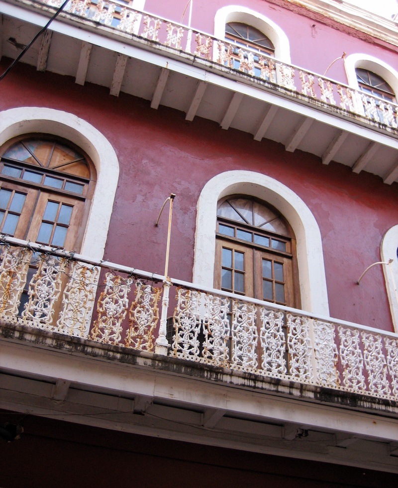 facade, pattern, balcony, wall, arches, day, city, transportation, red, window, porches, old building, in a row, building, low angle view, french doors