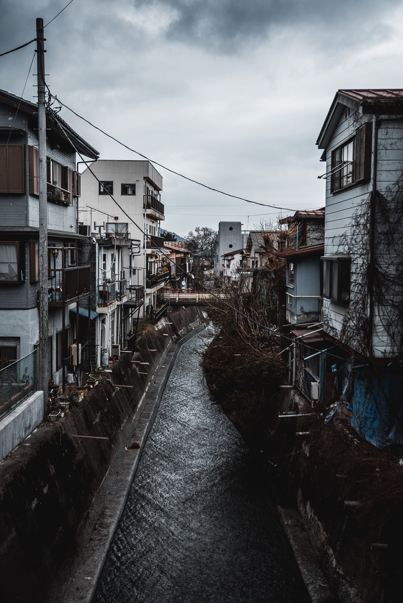 building, built structure, house, walkway, apartment building, building exterior, handrail, tarmac, water, high rise, urban, city, inline, no people, japan