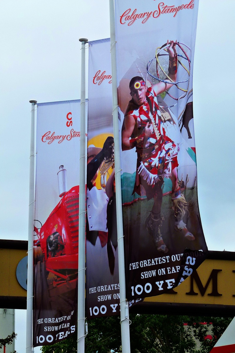 male likeness, day, 720P, text, human representation, flags, canada, outdoors, western script, script, architecture, female likeness, stampede, calgary