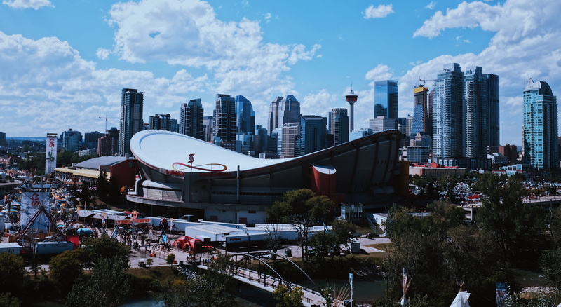 mode of transportation, cloud - sky, transportation, blue sky, sky, nature, tree, stampede, skyscraper, plant, tall - high, outdoors, rodeo, city, saddledome rise southeast