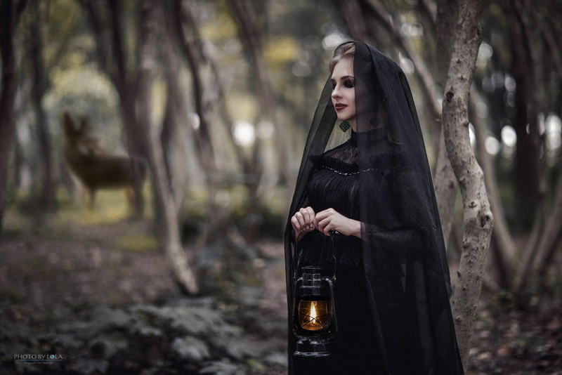trees, natural light, lipstick, closed eyes, women outdoors, dress, collar, bokeh, 720P, black clothing, forest, lantern, watermarked, makeup, black dress