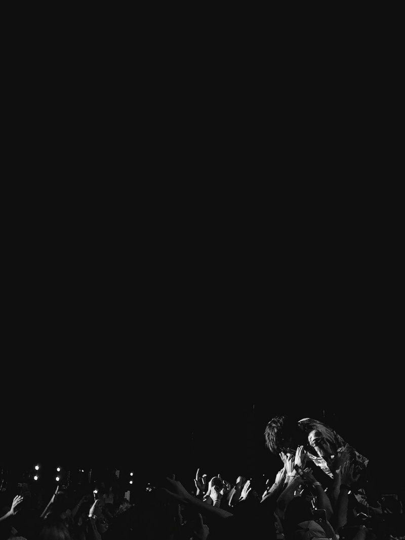 grayscale, copy space, indoors, crowd, lighting equipment, front, fun, event, arts culture and entertainment, pit, light - natural phenomenon, popular music concert