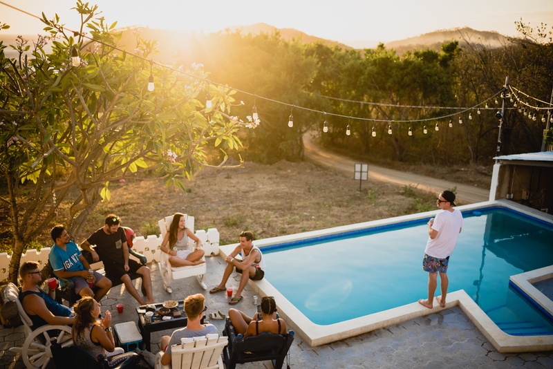 sitting, friendship, people, leisure activity, near, men, relaxing, evening, swimming, hangout, trip, chairs, friends, nature, real people, water, lens flare