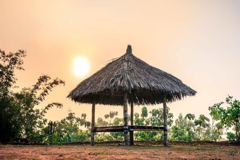 gazebo, thatched roof, sunset, non-urban scene, roof, sunny, outdoors, nature, tranquil scene, scenics, sky, sun, beautiful, land, no people