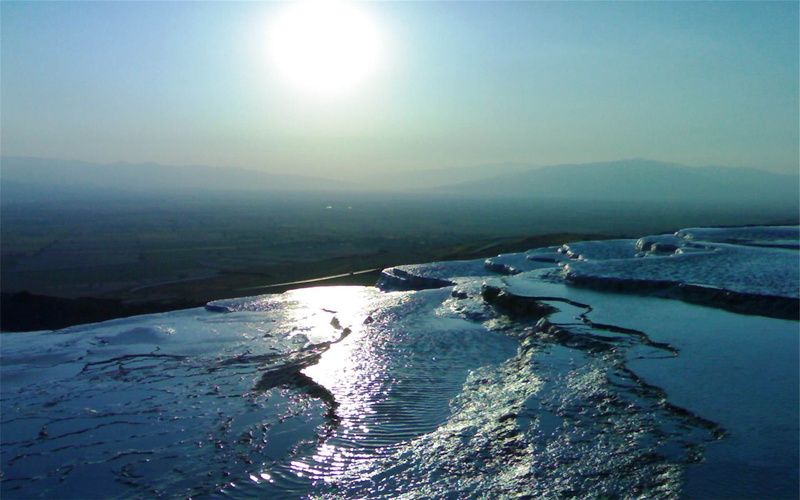 idyllic, day, horizon, no people, sun, water, tranquil scene, sunlight, lens flare, pamukkale, non-urban scene, photography, city, outdoors, mountain, cold temperature