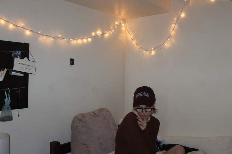 indoors, leisure activity, eyeglasses, sitting, headshot, lifestyles, fairy lights, dorm, sonoma state university, art hoe, 5K, united states, illuminated