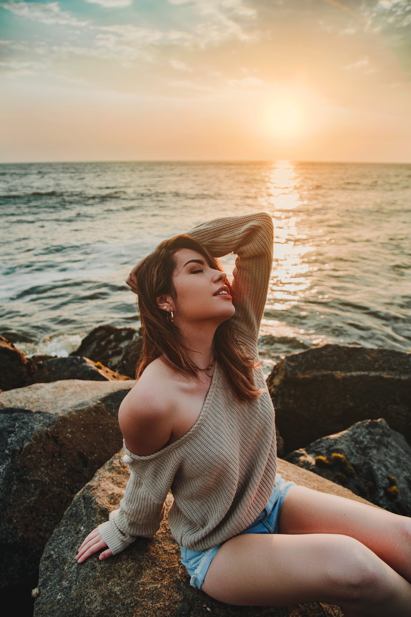 one person, water, outdoors, photographer, nature, tumblr, real people, peace, sunset, ocean, photography, leisure activity, portrait, sitting, solid, rock - object