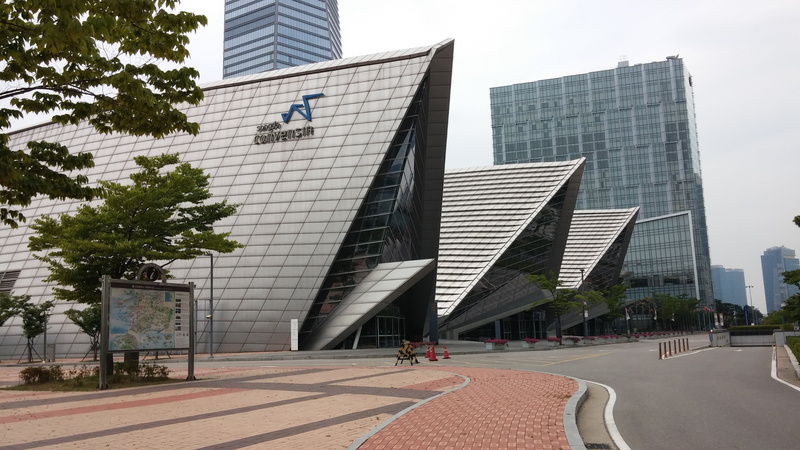low angle view, financial district, skyscraper, nature, songdo, built structure, plant, day, outdoors, building exterior, office, downtown district, city life