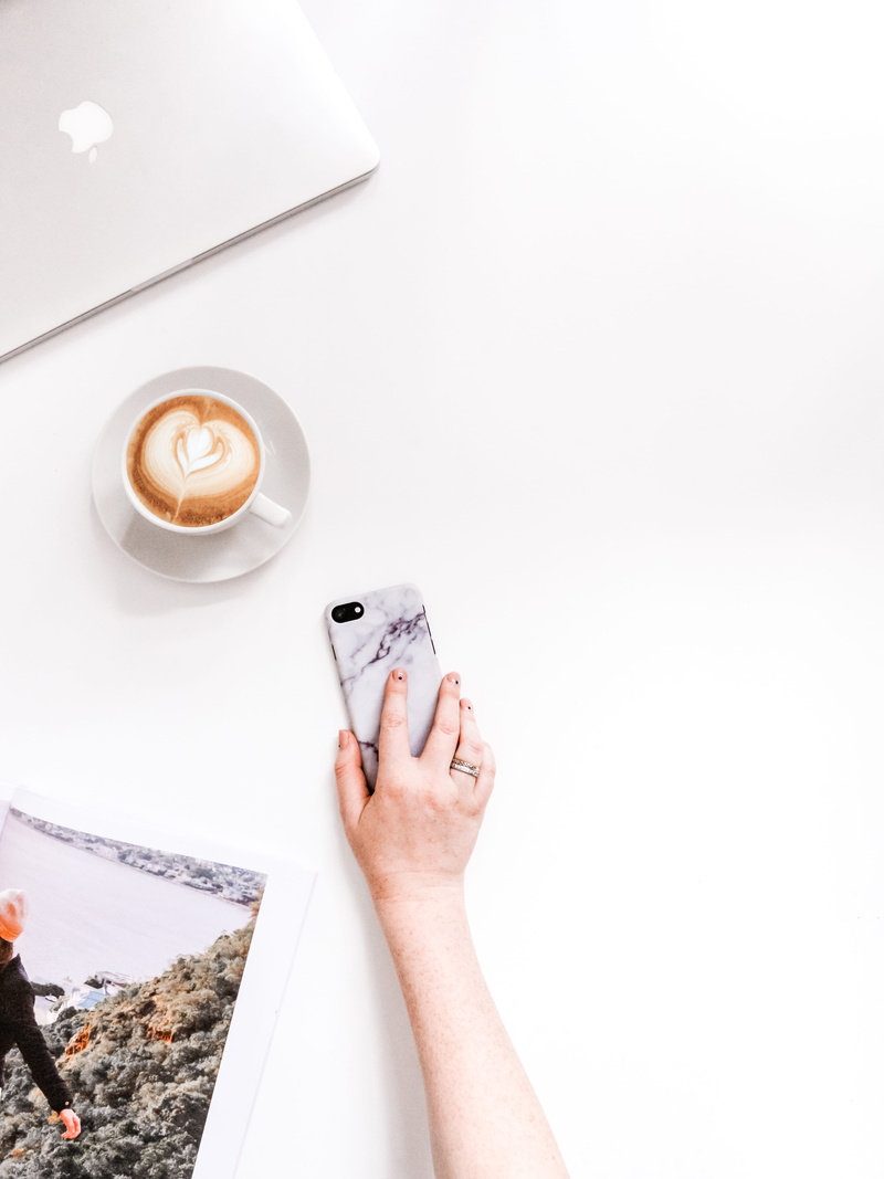 near, phone, pottery, electronics, porcelain, copy space, hand, smartphone, crockery, holding, hot drink, coffee - drink, refreshment, drink, human body part