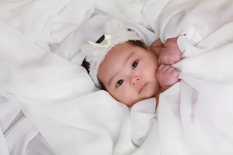 child, lying down, white, furniture, republic of korea, babyhood, white color, innocence, sheet, indoors, young, lying on back, chiu, looking at camera