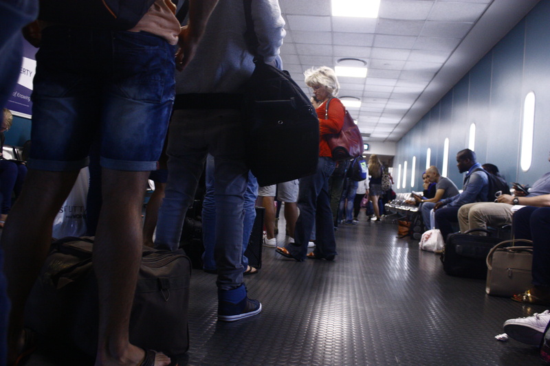 cape town, corridor, men, line, ceiling, lifestyles, arcade, casual clothing, airport, illuminated, standing, people, 4K, large group of people, transportation