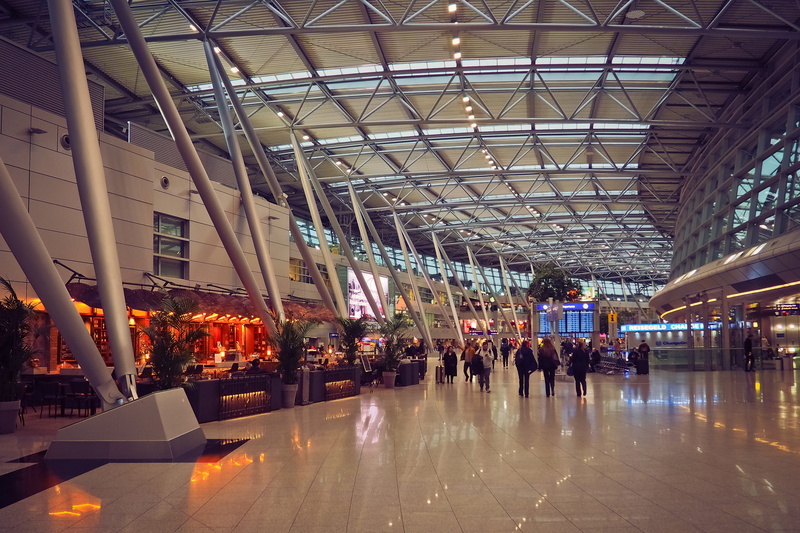 incidental people, journey, passenger transport, indoors, arrival, real people, reflection, glass - material, modern, glass, airport terminal, international