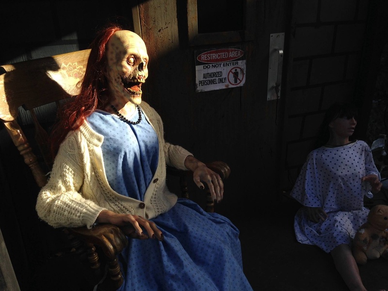 fall, lifestyles, communication, horror, decoration, scary, real people, festival, three quarter length, sitting, standing, human representation, death