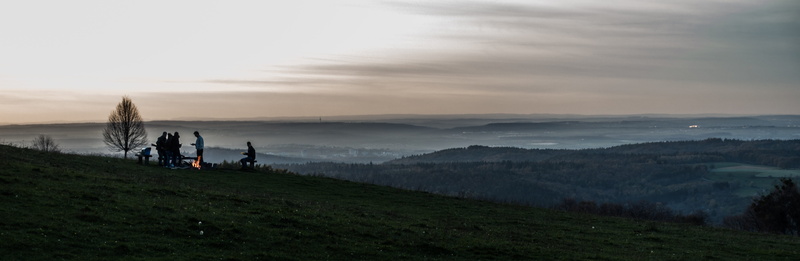 sunset, scenics - nature, outlook, outdoors, activity, group of people, leisure activity, fog, mountain, alb edge, cloud - sky, alb, water, landscape, grass