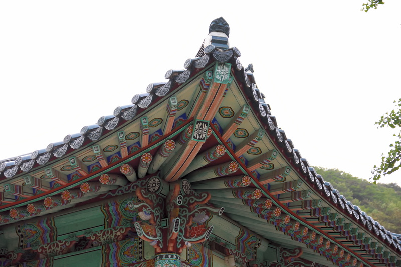 building, low angle view, architecture, nature, building exterior, sky, 5K, clear sky, art and craft, roof, spirituality, religion, belief, eaves, the past