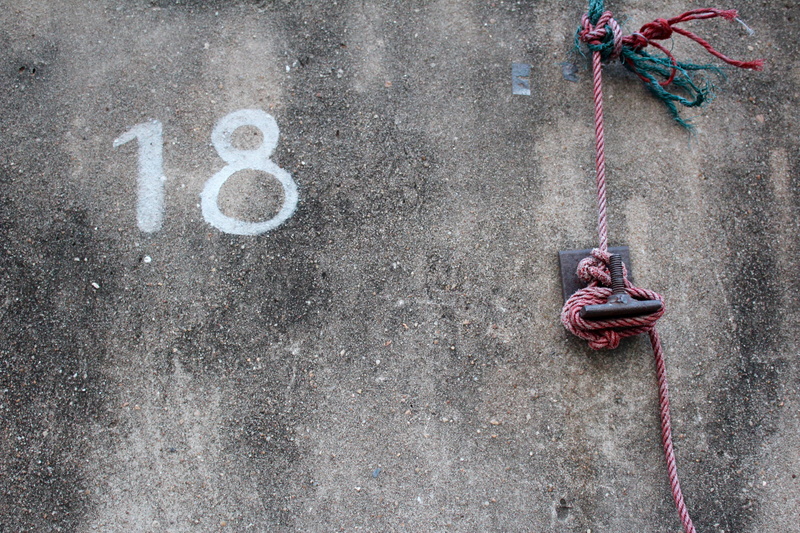 pink color, rope, multi colored, connection, hanging, wall - building feature, close-up, eighteen, strength, concrete, 18, outdoors, day, red, textured