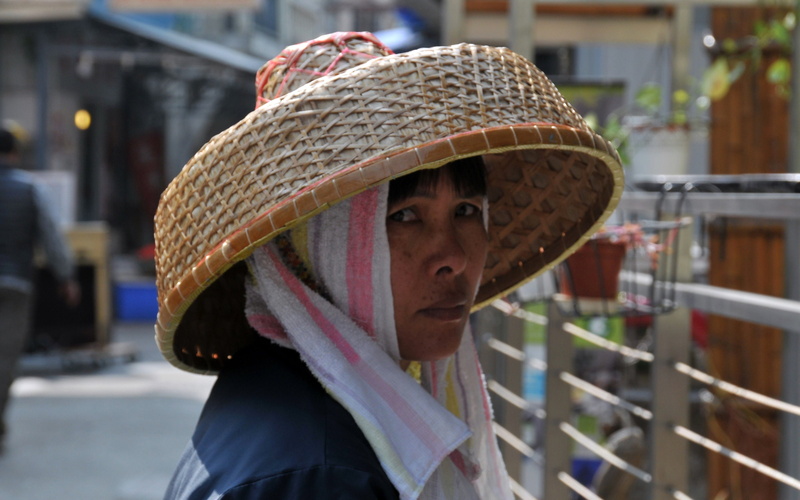 protection, clothing, close-up, native, focus on foreground, lifestyles, casual clothing, hat, real people, portrait, rice straw, warm clothing, china