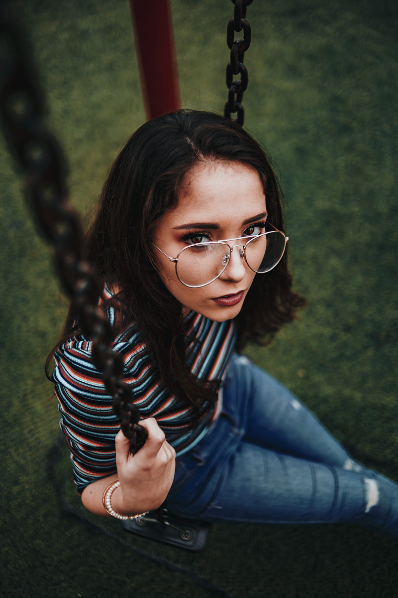 peruvian, outdoors, face, outdoor, brunette, one person, model, female, lady, sitting, eyeglasses, woman, teenager, girls, park, young adult, wearing, fashion