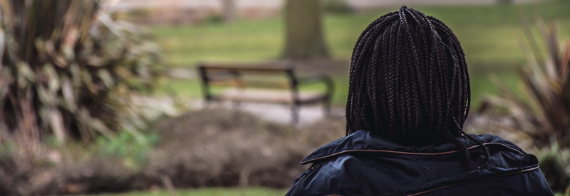 hood, field, one person, person, back view, black color, nature, day, hat, african braids, focus on foreground, land, solitude, obscured face, outdoors