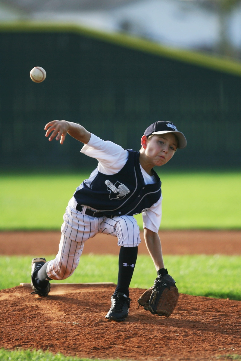 hitting, fence, full length, pitch, child, males, field, throw, baseball - ball, outdoors, competition, action, uniform, motion, infield, clothing, american