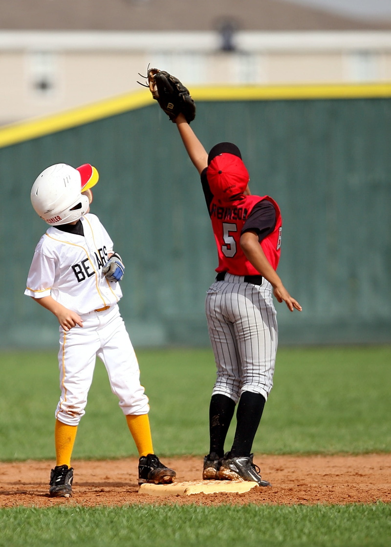 child, two people, runner, real people, fence, outdoors, full length, people, helmet, 1080P, young, competition, clothing, grass, players, athletic, boy