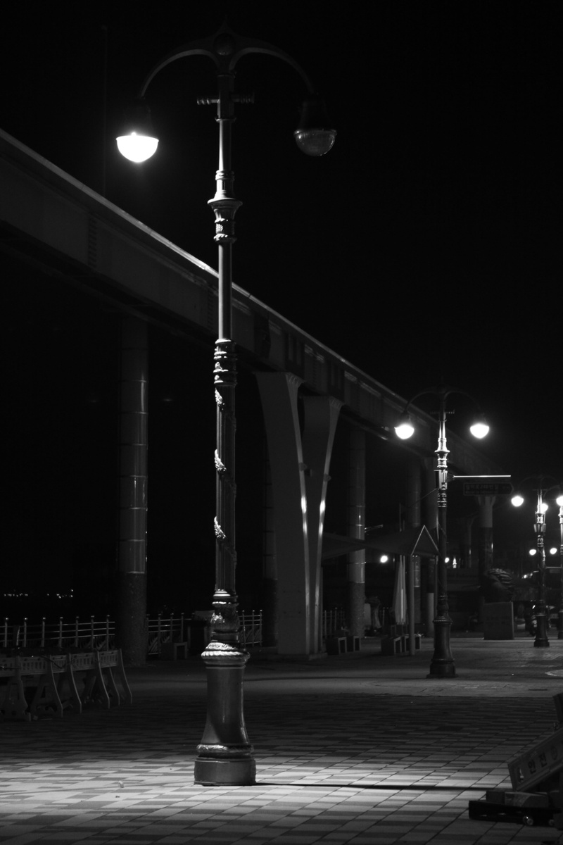 in a row, landscape, night view, city, direction, building exterior, night landscape, the way forward, outdoors, transportation, street light, no people
