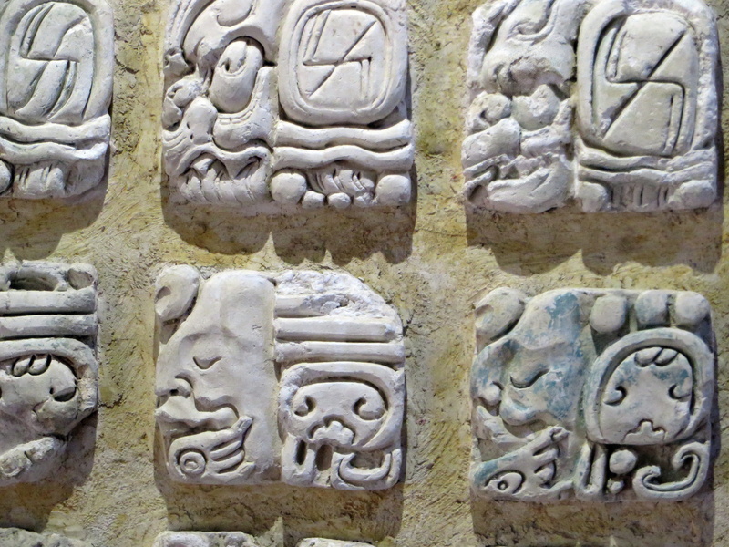 columbian, bas relief, close-up, Palenque, built structure, Mayan Glyphs, human body part, 4K, writing, ancient civilization, Museum, the past, outdoors
