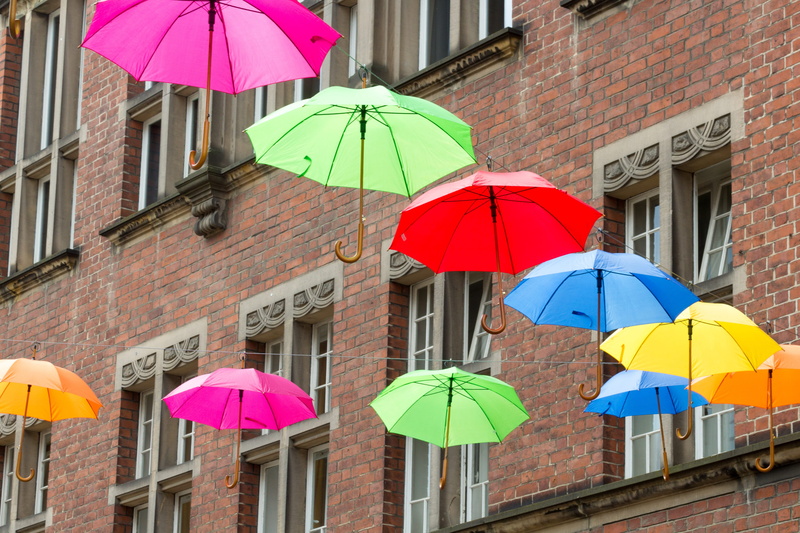 assorted, multi colored, high, blue, festivity, lined up, protection, color, stand out, day, top, hanging, built structure, umbrella, sky, rain, yellow