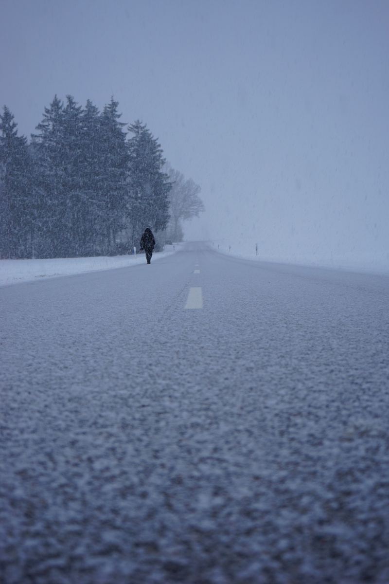 leisure activity, tranquil scene, sky, land, snowfall, walking, outdoors, alone, lifestyles, frost, snow, winter storm, central reservation, human, scenics - nature