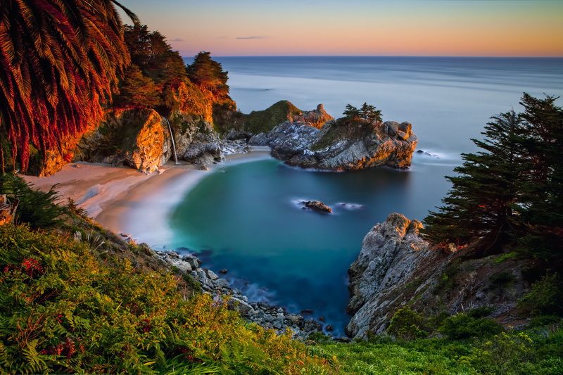 sunset, solid, land, 5K, green, stones, rock - object, rocks, CA, waterfall, sky, sea, tree, grass, horizon, shore, horizon over water, rock, non-urban scene