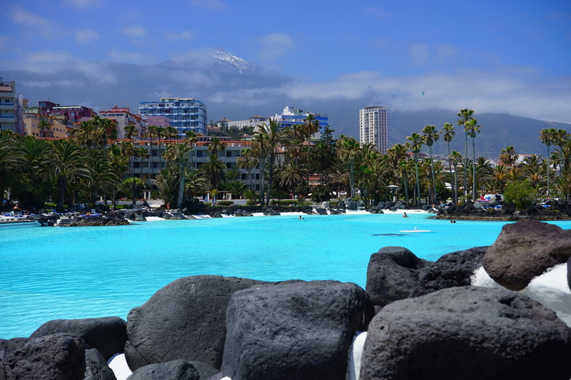 fun bathing, teide, outdoors, sky, rock - object, clear, wet, palm Tree, swim, blue, land, water, nature, tree, pool, building exterior, cool, luxury, skyscrapers
