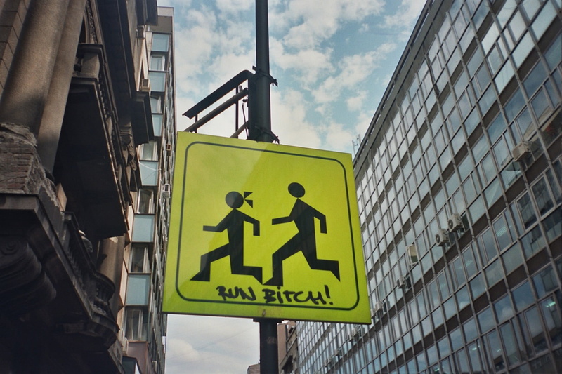 representation, building exterior, built structure, low angle view, pedestrian crossing sign, outdoors, street light, cloud - sky, children, information