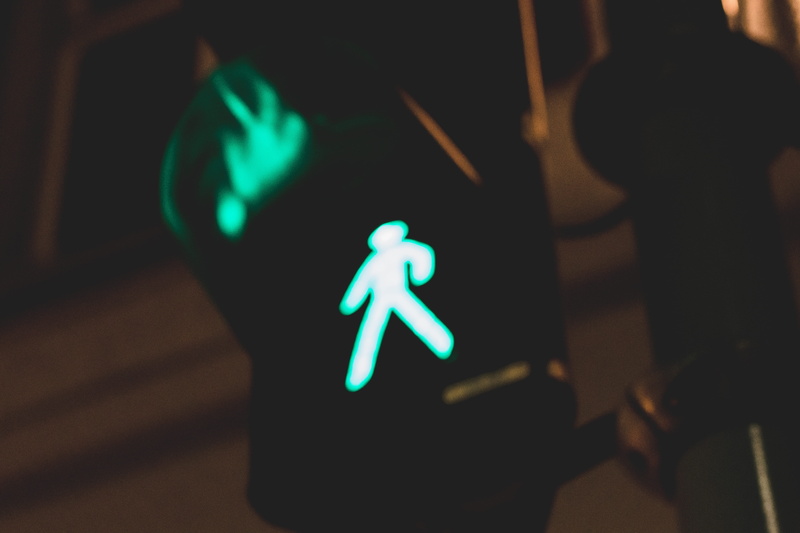 symbol, human representation, green color, illuminated, dark, road sign, light, night, care, sign, stoplight, close-up, 5K, male likeness, communication