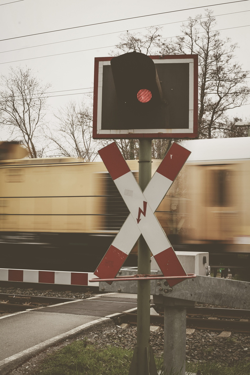 communication, advertisement, asphalt, image, vehicle, airplane, blurred motion, path, train, outdoors, day, stop, zebra crossing, train - vehicle, pedestrian
