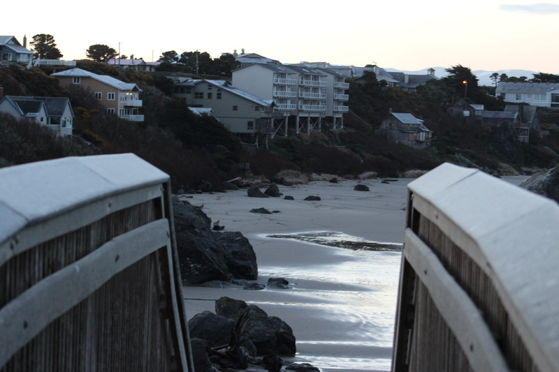 urban, vegetation, house, shoreline, outdoors, coast, day, vehicle, no people, building exterior, built structure, residential district, train, winter