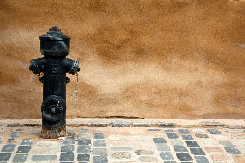 belief, building exterior, cannon, beside, wall, brown, fire, black, hydrant, travel destinations, old, religion, outdoors, sunlight, water, nature, travel