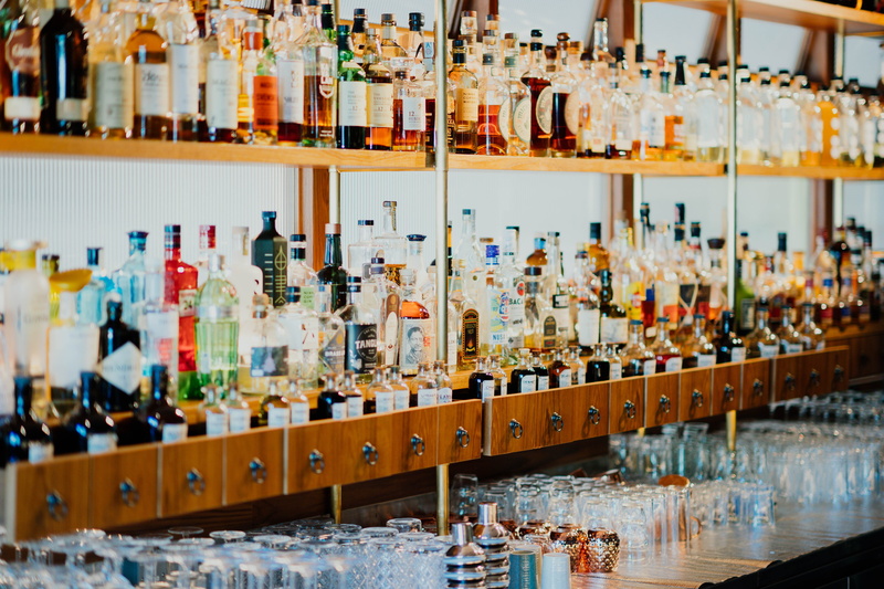 no people, worker, variation, side by side, wine, large group of objects, abundance, collection, alcohol, bar counter, beer bottle, absinthe, bottle, banister
