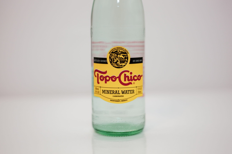 drink, topo, perfume, spoke, wheel, alcohol, single object, gin, transparent, liquor, topo chico, close-up, bottle, chico, focus on foreground, tequila