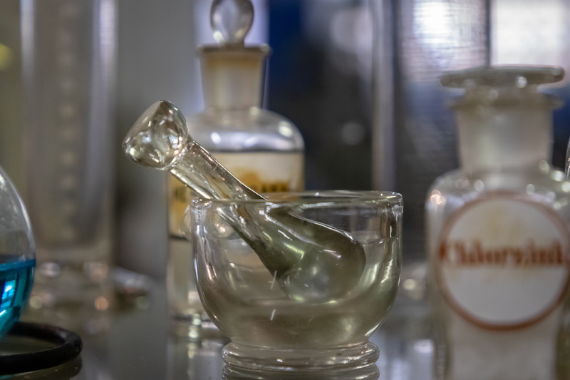 cocktail, indoors, weaponry, table, household equipment, 5K, bottle, sphere, mortar, transparent, mixing bowl, pub, alcohol, cannon, weapon, variation