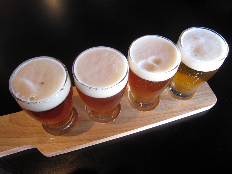indoors, drinking glass, pint glass, wood - material, food and drink, table, drink, glass, still life, high angle view, no people, beer glass, household equipment