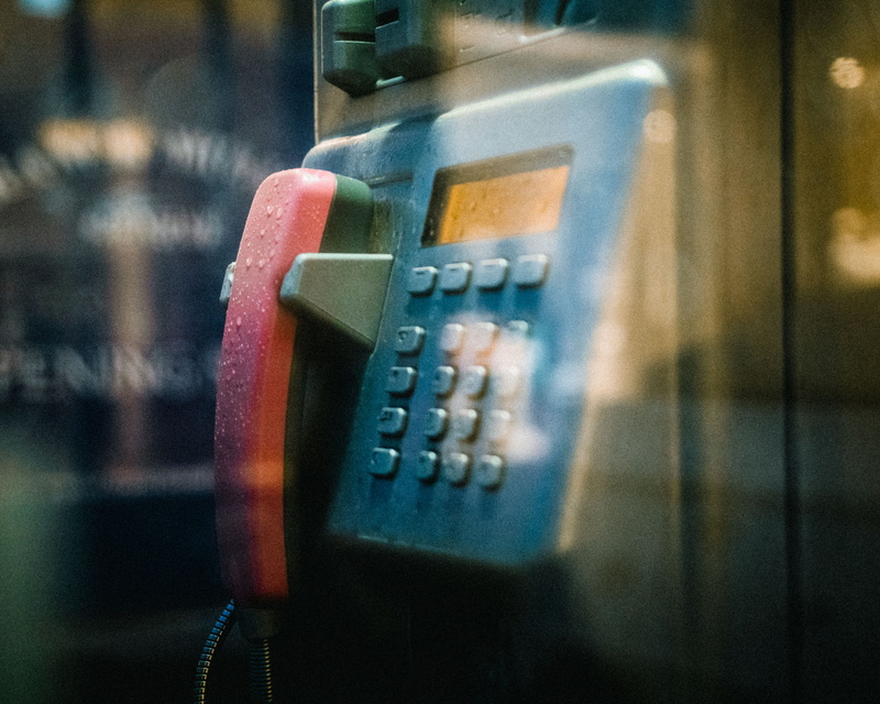 indoors, telephone, blue, pay phone, electronics, electronic chip, machinery, corded, camera, push button, transportation, phone booth, phone, telephone receiver