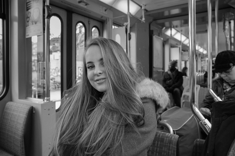 leisure activity, young women, black and white, smiling, 5K, zürich, real people, looking at camera, vehicle interior, focus on foreground, incidental people