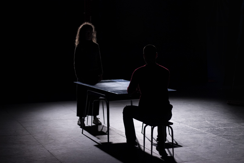 france, human, table, front, chair, one person, actors, people, dark, man, real people, flooring, arts culture and entertainment, comedy, light, black and whiten