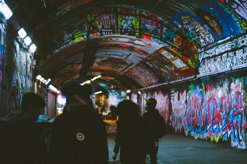 bar counter, 5K, indoors, corridor, tunnel, adult, lighting, arcade game machine, light, apparel, real people, lifestyles, rear view, mural, clothing