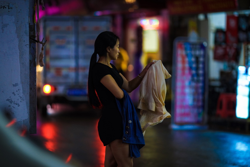 contemplation, adult, 8K, city, store, finger, gown, shopping, woman, one person, holding, consumerism, focus on foreground, arcade game machine, casual clothing